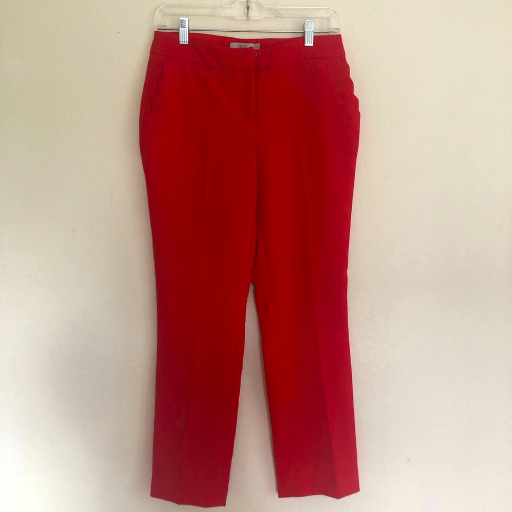 Red slacks with scalloped pockets